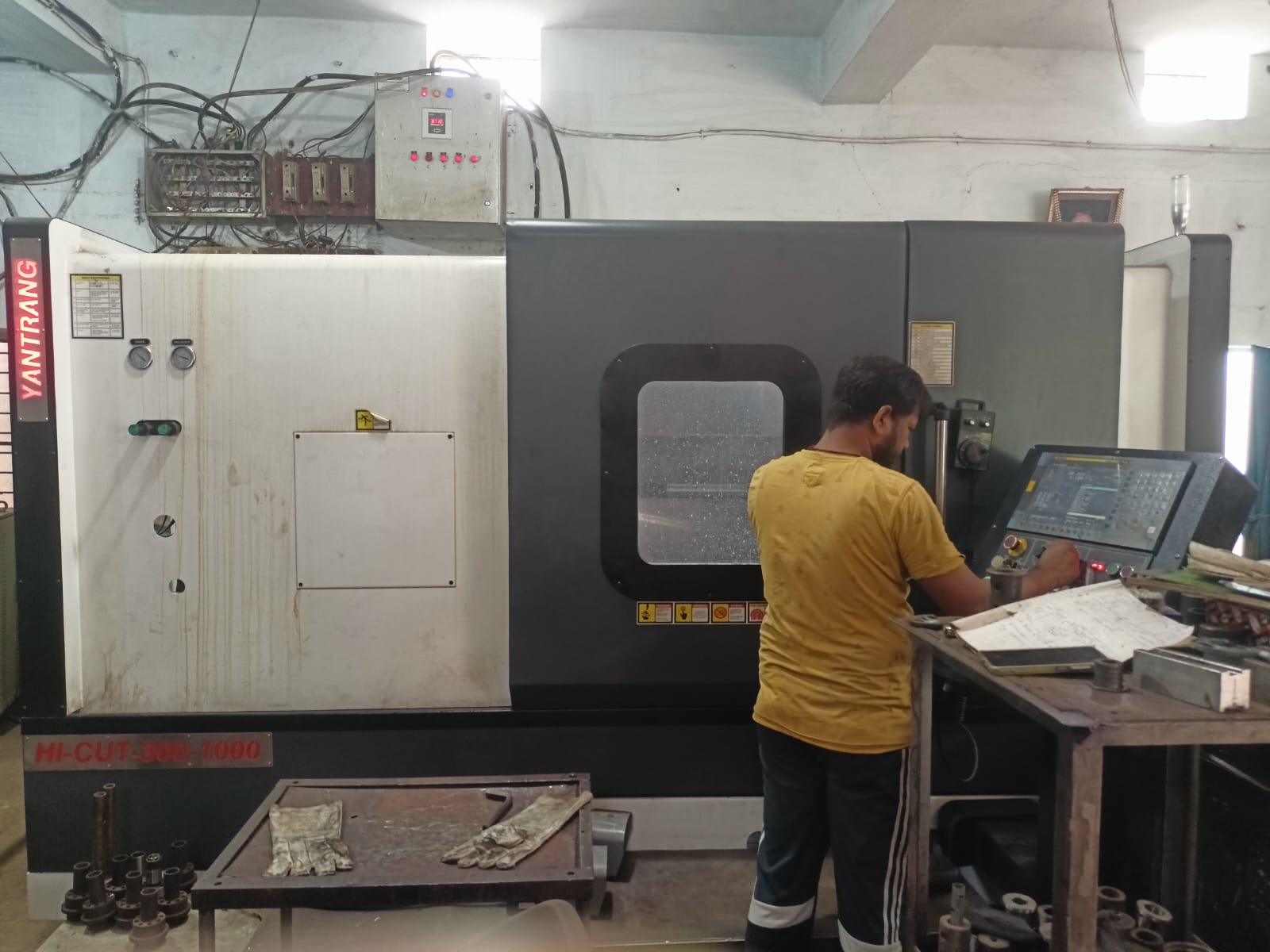 Yantrang Hi-Cut CNC turning center with operator at Mohan Engineering workshop